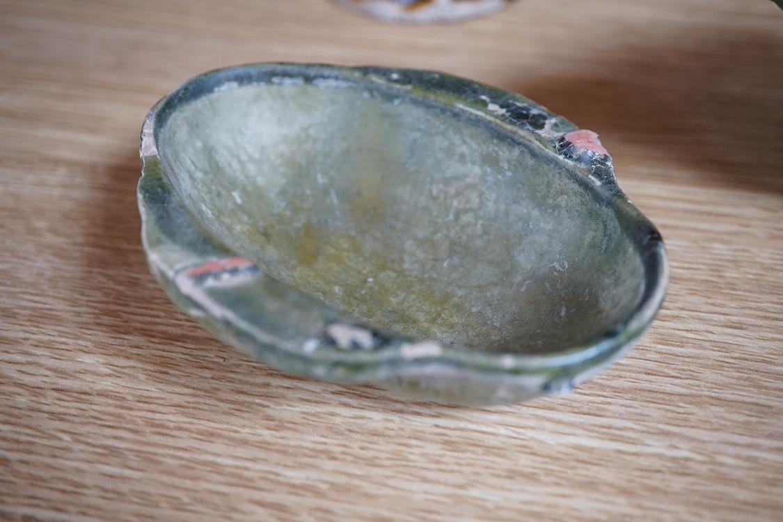 Four Tang dynasty and later pottery items, to include an ear cup, largest 15cm high. Condition - fair